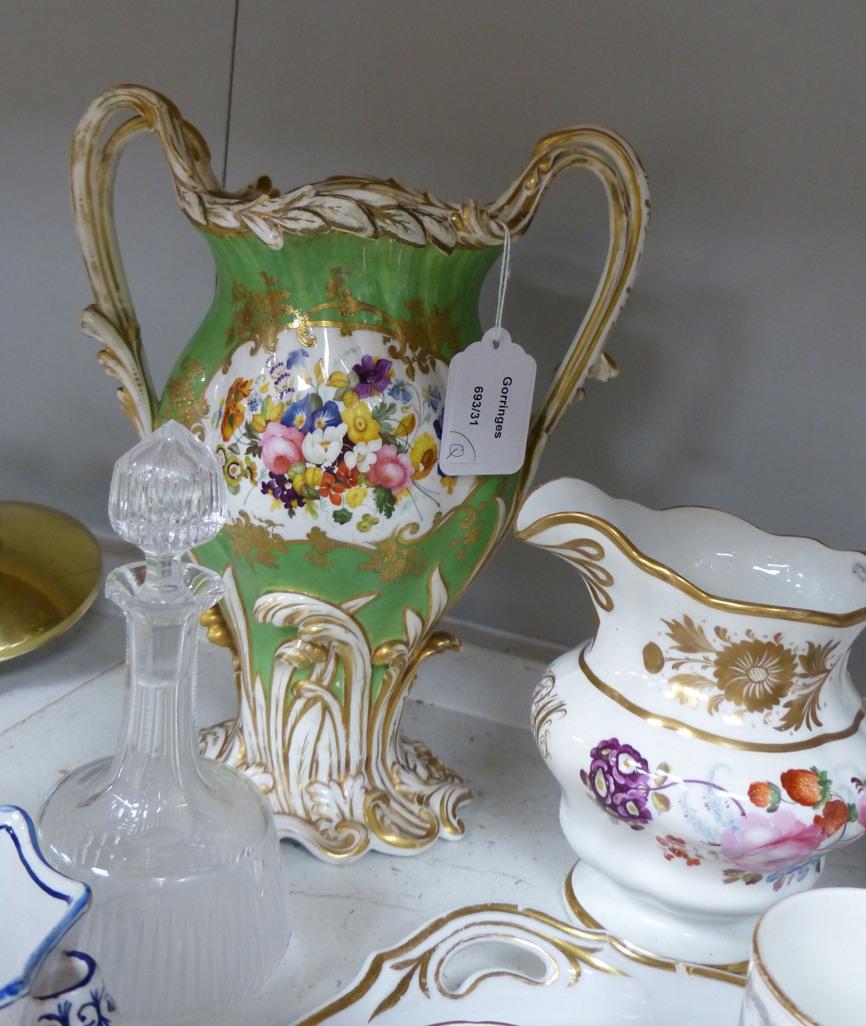 A Continental porcelain two handled tray painted with flowers and gilded with initials, a large English vase, a pair of Delft of vases, two Foley cup and saucers, two English jugs and other items